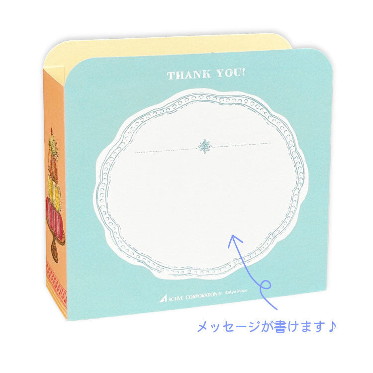 A square thank-you card shown on a white background. The front is light aqua blue with a large white scalloped oval writing area and the words 'THANK YOU!' at the top.