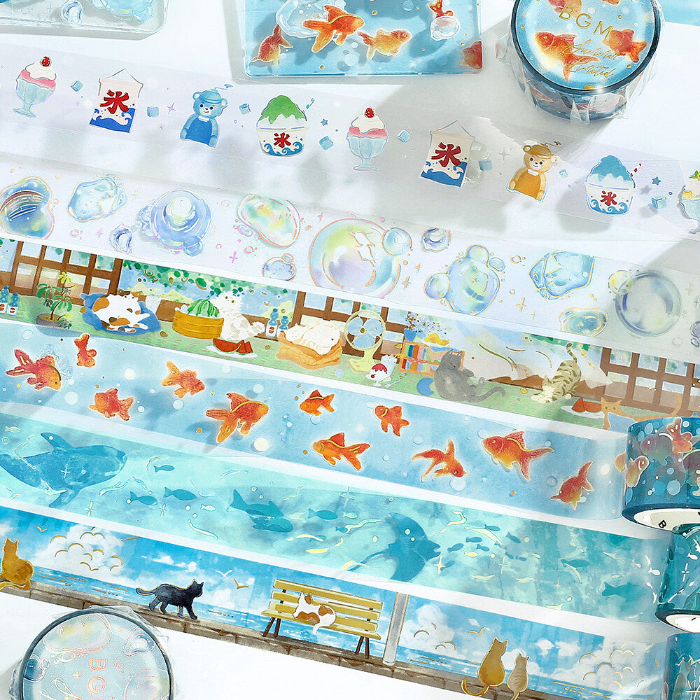 Set of decorative tape rolls with underwater and animal-themed designs on a white background.