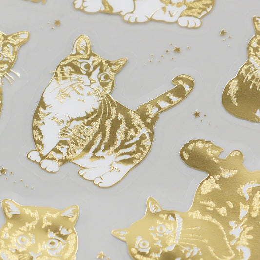 Gold and white cat illustrations on a light gray background
