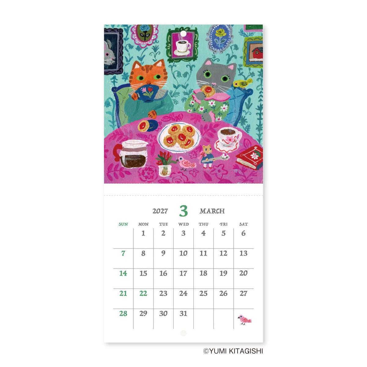 A vertical wall calendar page featuring a colorful illustration of two cats sitting at a table with tea and sweets, above a printed March 2027 calendar grid. The artist name YUMI KITAGISHI appears at the bottom.