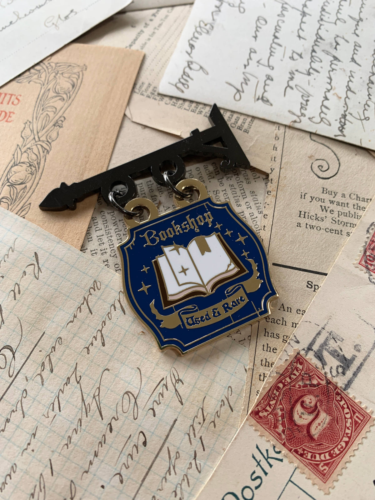 The Creeping Moon - Enamel Pin - Bookshop Sign