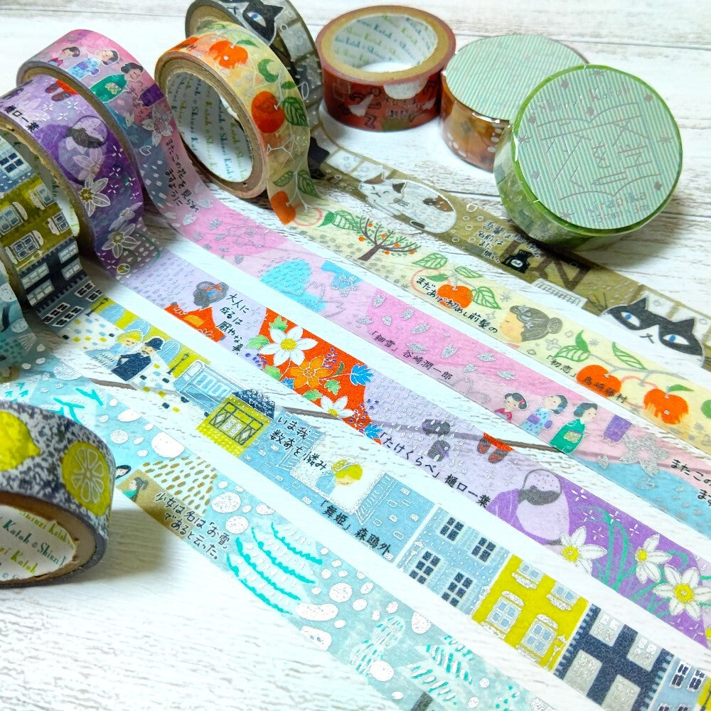 Decorative tape rolls with various designs on a white surface