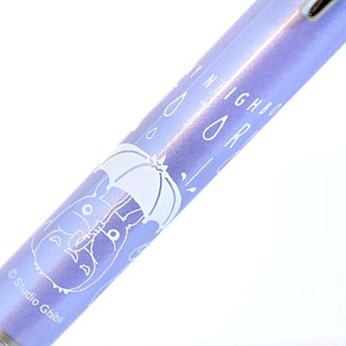 A Kurutoga Advance 0.3mm mechanical pencil in a translucent lavender purple color, with Totoro on the barrel