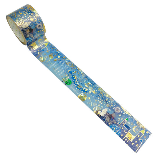 Roll of decorative tape with a flying train and starry design featuring shining gold foil details on a white background