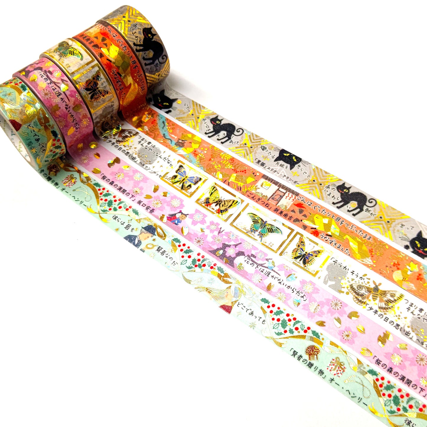 Set of colorful washi tape rolls with various designs on a white background