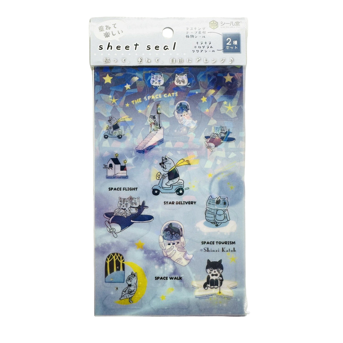 Packaging of SEAL-DO Shinzi Katoh Holographic Stickers featuring various whimsical designs including cats, planets, and astronauts against a starry night background.