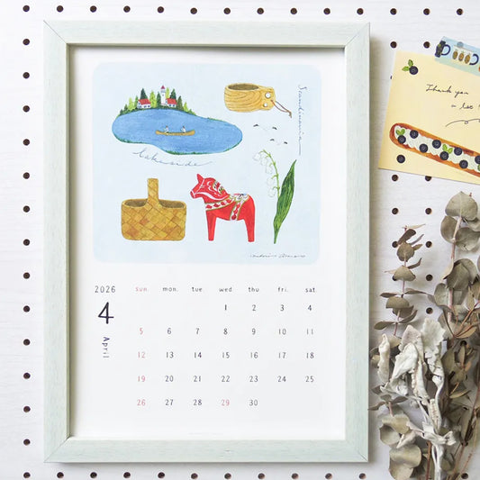 Framed calendar with illustrations of a lake, boat, and horse figurine on a pegboard background.