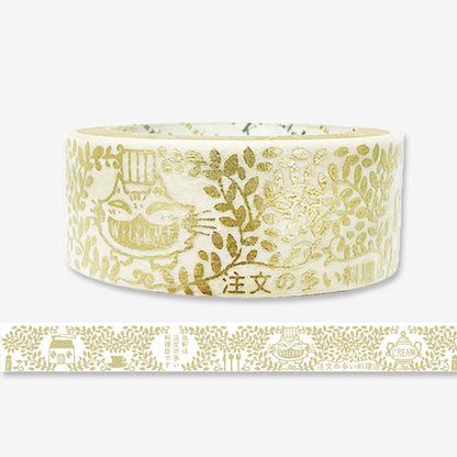 Roll of decorative tape with gold patterns on a white background