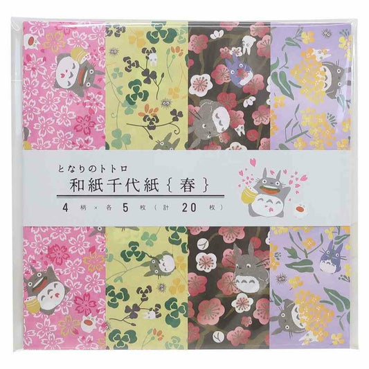 A packaged set of Japanese Totoro-themed paper sheets with multiple floral and character patterns, shown in a clear plastic sleeve with a white paper band label.