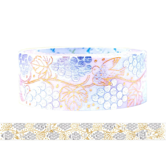 A roll of decorative washi tape featuring a pattern grapes, birds, and gold vine details