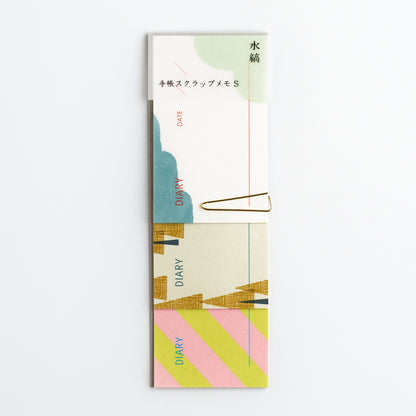 Colorful diary memo pad with geometric design on a white background