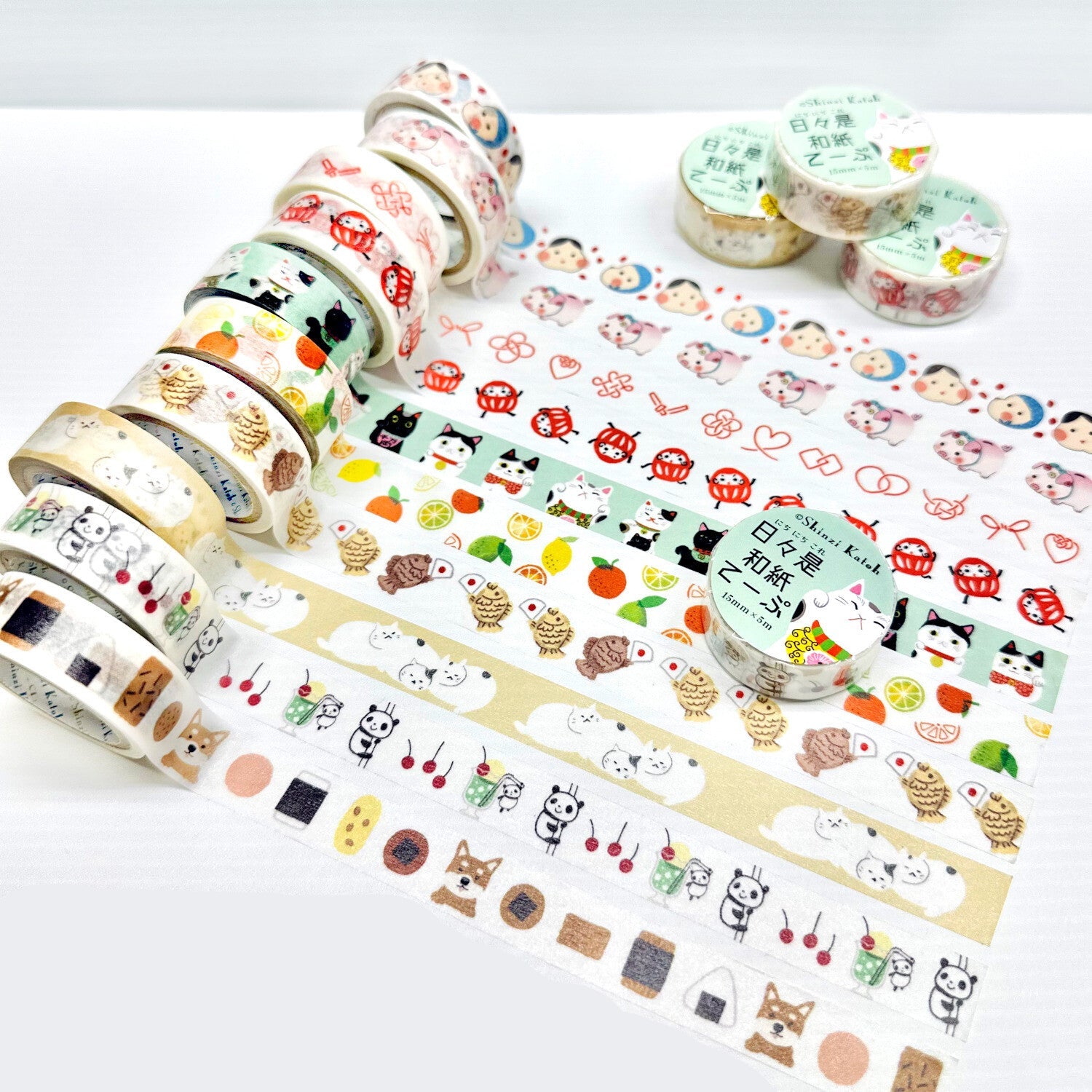 Collection of colorful washi tape rolls with various designs on a white background