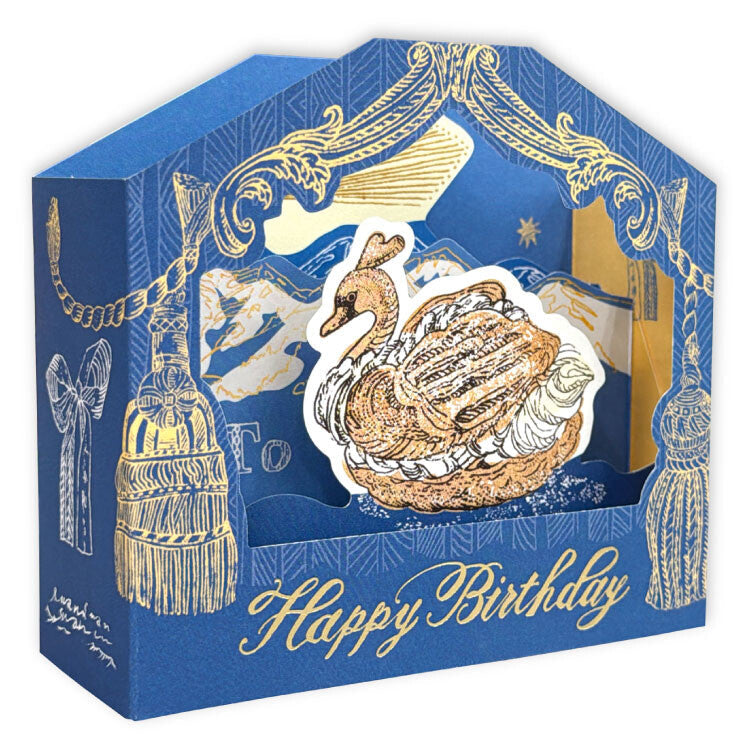 A blue and gold birthday card box with a 3D swan illustration popping out from the center, shown on a white background.