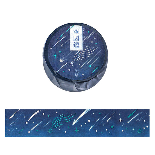 Washi tape with star and comet design on a blue background