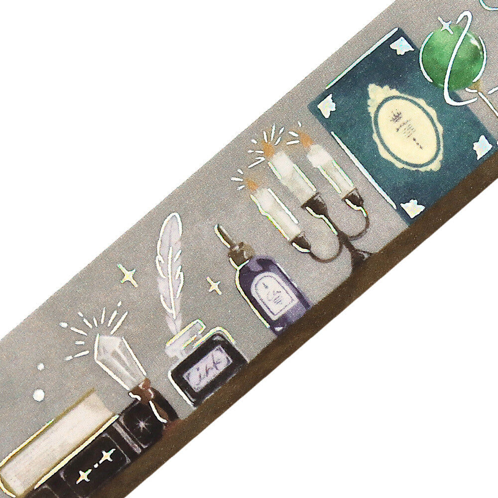 Decorative washi tape with illustrations of candles, bottles, and other elements on a gray background.