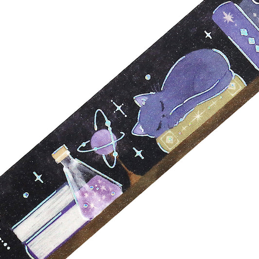 Decorative tape with a cat, book, and potion design on a black background