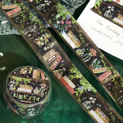 Decorative tape with fantasy-themed designs on a green fabric background