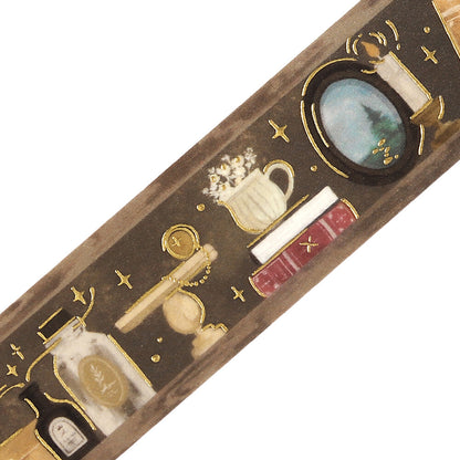 Decorative washi tape with intricate bookshelf designs and small objects on a white background