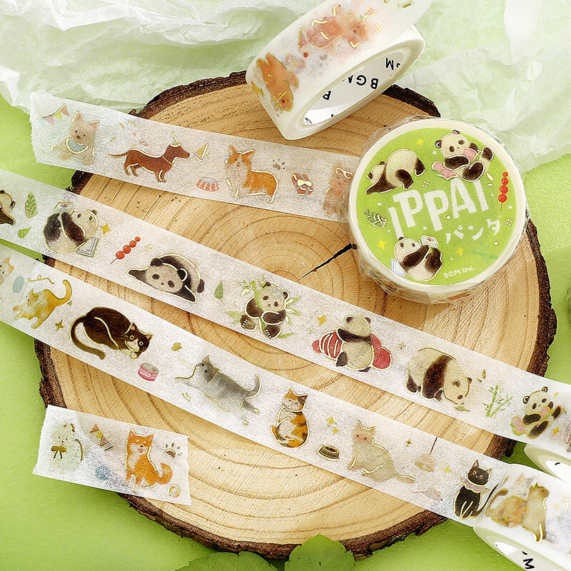 Washi tape with animal designs on a wooden block