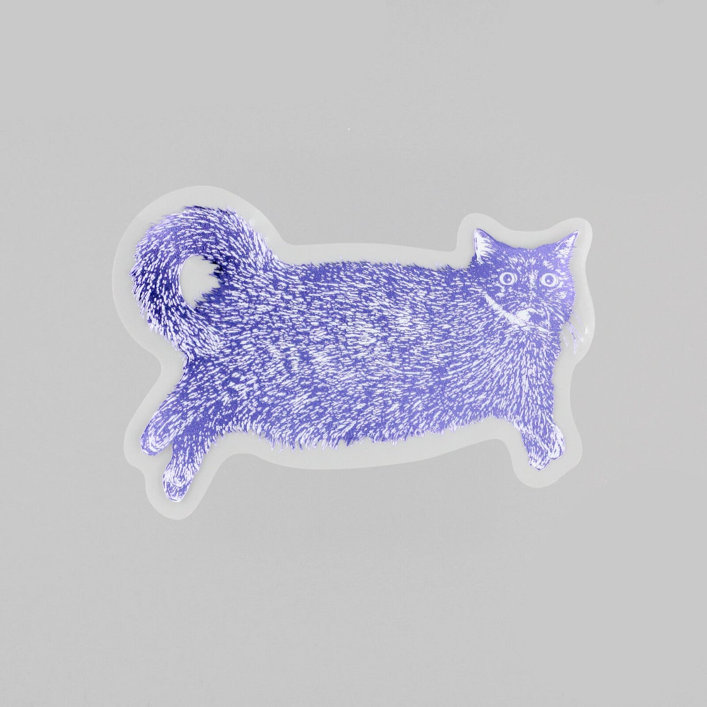 A purple glitter cat-shaped sticker with white eyes and a small smile, shown on a light gray background