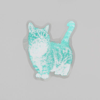 A die-cut sticker featuring a stylized cat illustration in mint green and white, shown on a light gray background