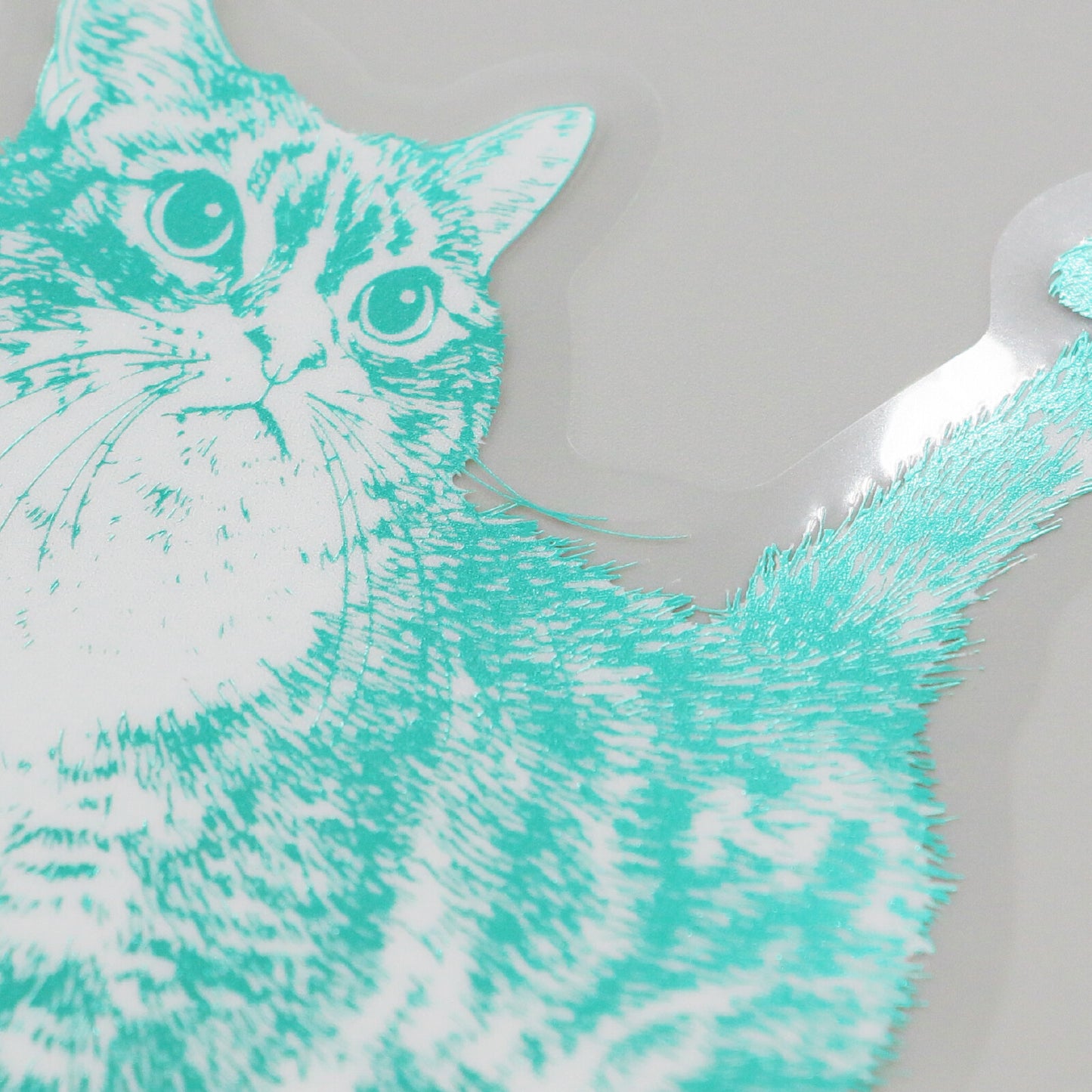 Teal and white cat sticker on a white background