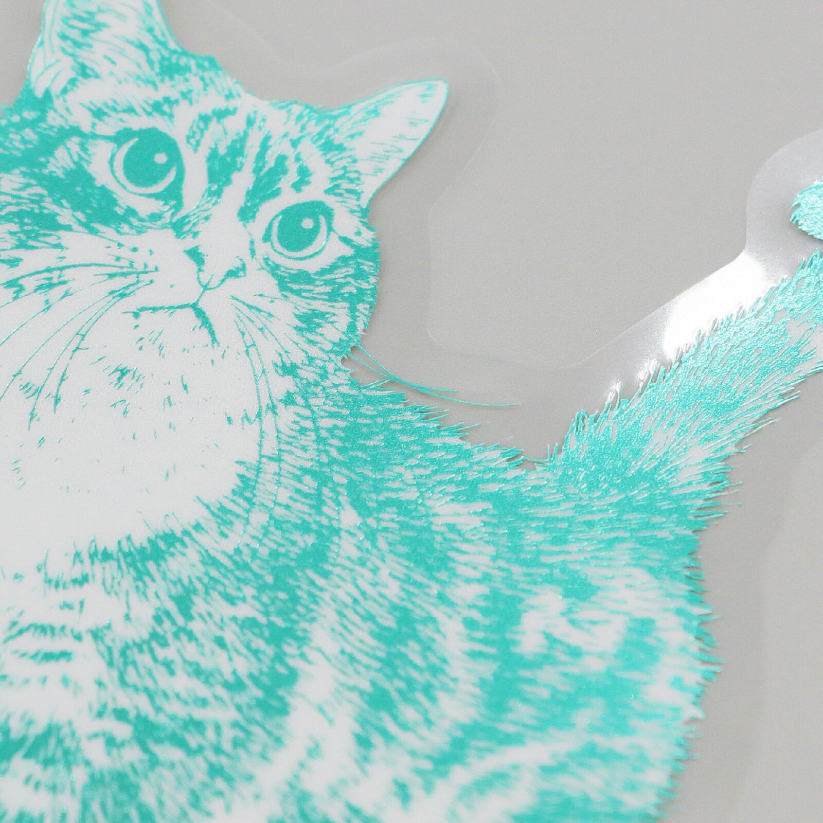 Teal and white cat sticker on a white background