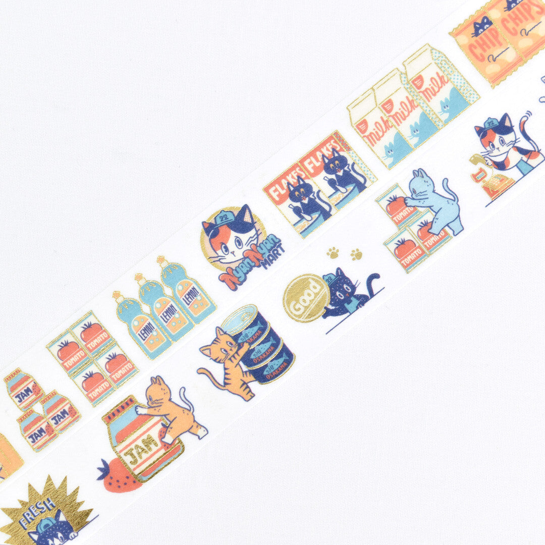 A close-up of a decorative washi tape roll featuring cute cartoon cats, milk cartons, and grocery items in pastel colors on a white background.