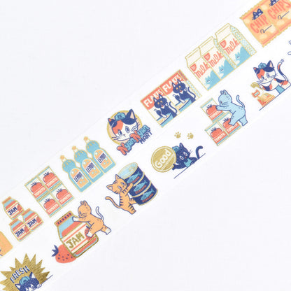 A close-up of a decorative washi tape roll featuring cute cartoon cats, milk cartons, and grocery items in pastel colors on a white background.