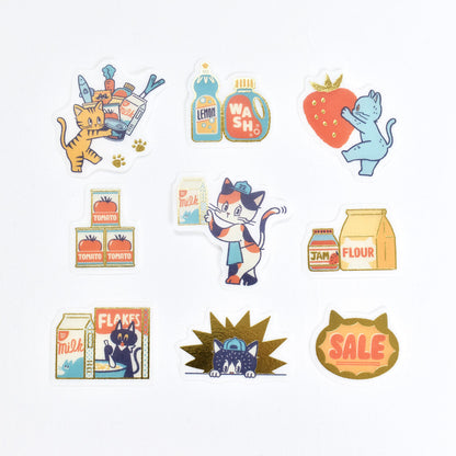 A set of die-cut stickers featuring cats in various grocery-themed scenarios, displayed on a clean white background.