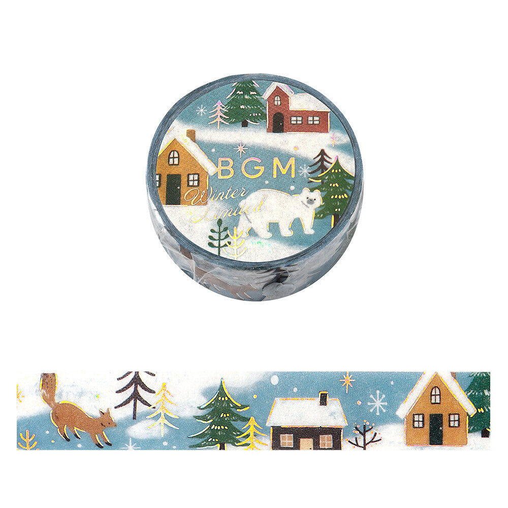 A roll of decorative washi tape with a winter village scene, shown closed with the brand name 'BGM Winter Limited' printed on it, and a strip unrolled below. The design includes snowy houses, evergreen trees, snowflakes, and a fox on a light blue background.