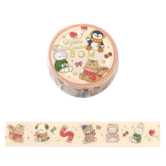 A roll of decorative washi tape with a winter-themed illustration, shown above a strip of the tape unrolled. The design features cute cartoon animals in holiday outfits on a light cream background.