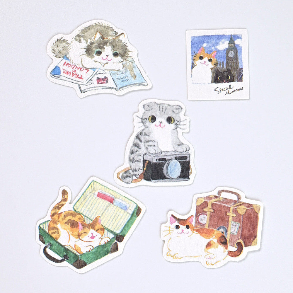 Set of cat-themed stickers on a light gray background