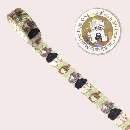 Curious cats themed washi tape shown unrolled diagonally, featuring illustrated cats in black, brown, and beige tones on a pale green background. 