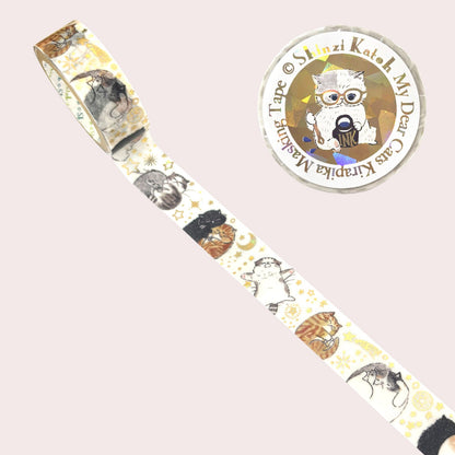 A roll of decorative masking tape with a whimsical cat illustration pattern, shown diagonally on a pale pink background.