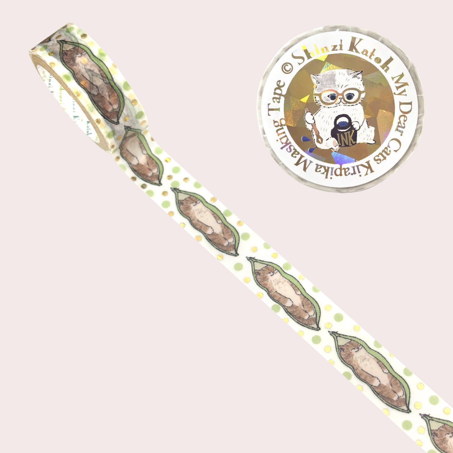 A roll of decorative washi tape with a repeating pattern of a cat snuggled inside a soybean pod, shown on a pale pink background. 