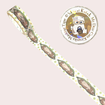 A roll of decorative washi tape with a repeating pattern of a cat snuggled inside a soybean pod, shown on a pale pink background. 