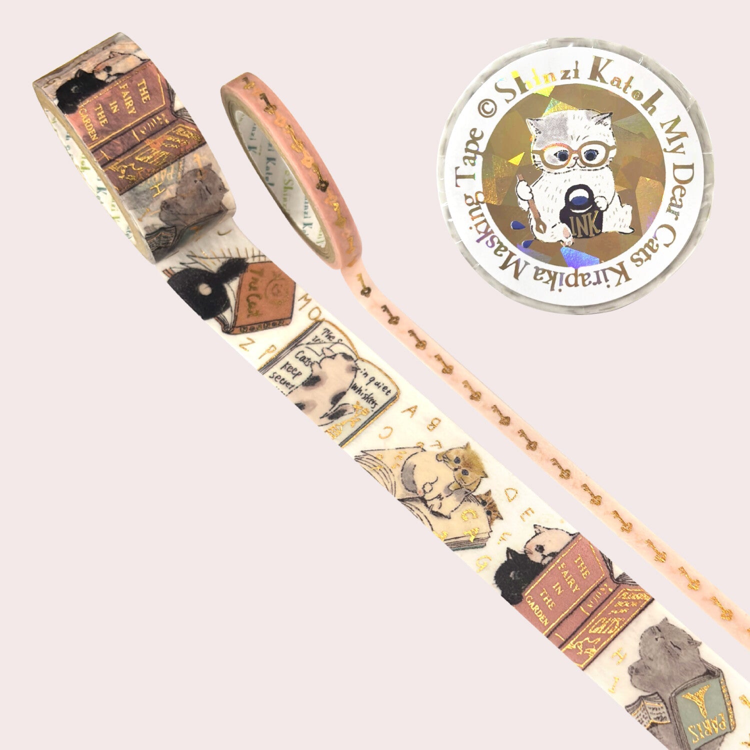 A roll of decorative washi tape with vintage book and cat illustrations 
