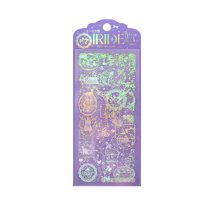 A purple holographic PET sticker sheet in its retail packaging, featuring various decorative illustrations with an iridescent rainbow sheen. The package is shown on a white background.