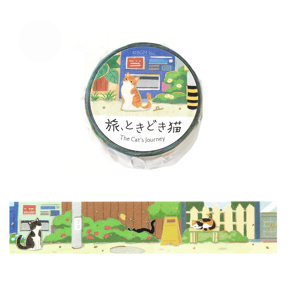 A roll of illustrated washi tape labeled 'The Cat's Journey' with a cats sitting in an alleyway with vending machines, picket fences, and signs, shown above a narrow horizontal strip preview of the tape design. 