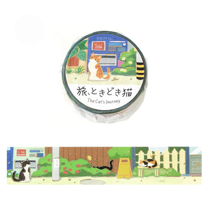 A roll of illustrated washi tape labeled 'The Cat's Journey' with a cats sitting in an alleyway with vending machines, picket fences, and signs, shown above a narrow horizontal strip preview of the tape design. 