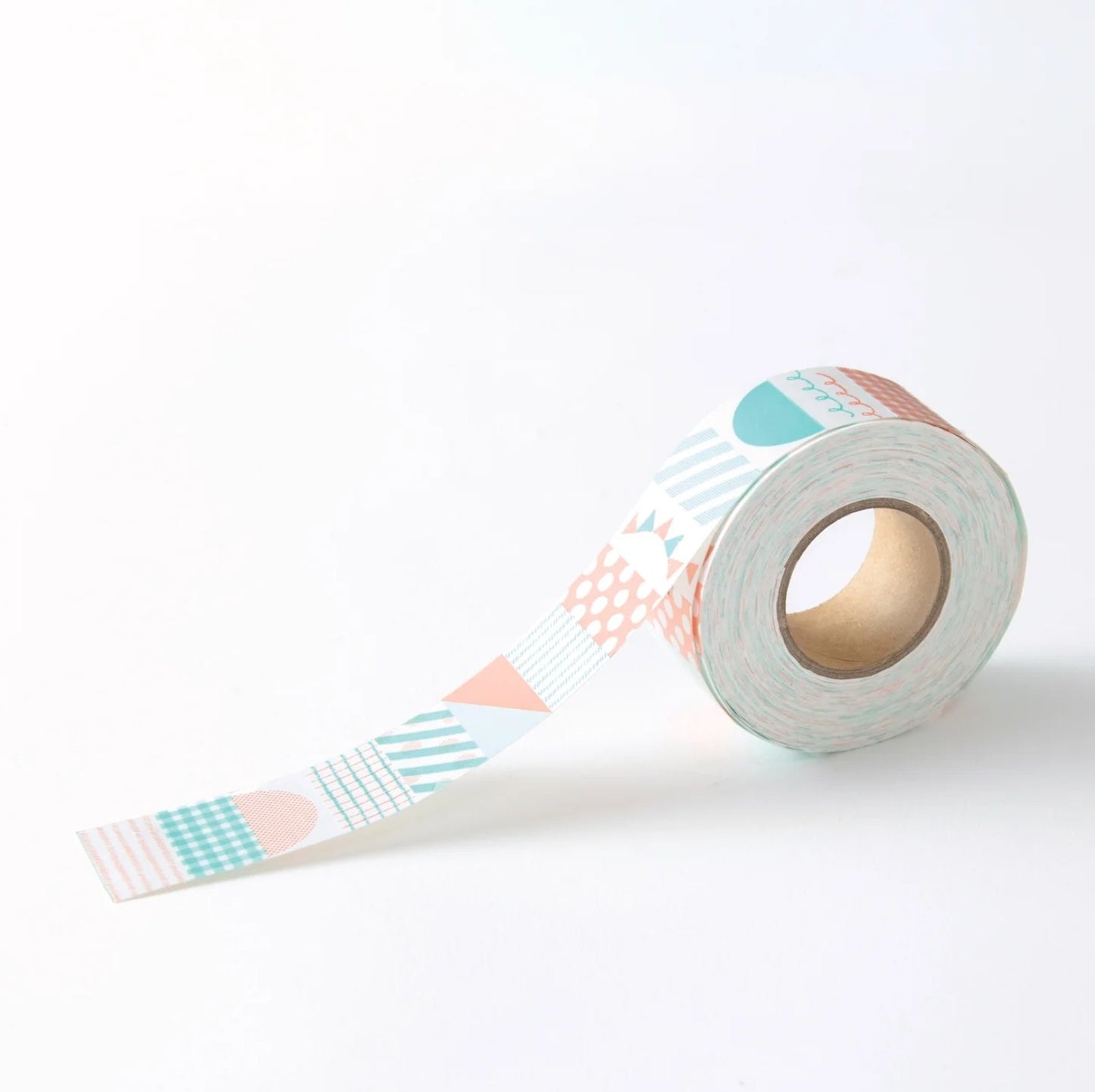 A roll of sticker tape with a pastel geometric pattern, partially unrolled on a clean white background.