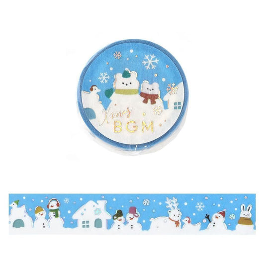 A roll of decorative washi tape with a winter Christmas theme, featuring snowmen, houses, reindeer, and snowflakes on a light blue background. The top of the tape has gold foil text reading 'Xmas BGM'.