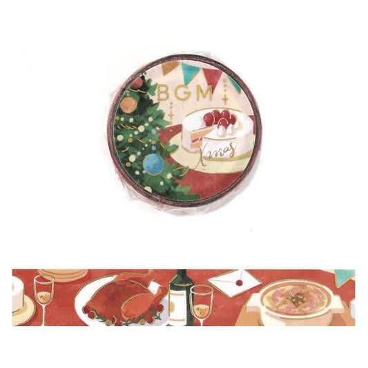 A round decorative washi tape shown above a strip of the design. The design features a Christmas tree, a slice of cake with strawberries, bunting, a roast turkey, casserole, and drinks.