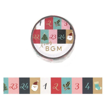 Christmas-themed washi tape roll with a circular label reading 'Xmas BGM' and a strip sample below showing festive panels with numbers, holly, Santa, and a stocking. A yellow circle with Japanese text appears in the top left