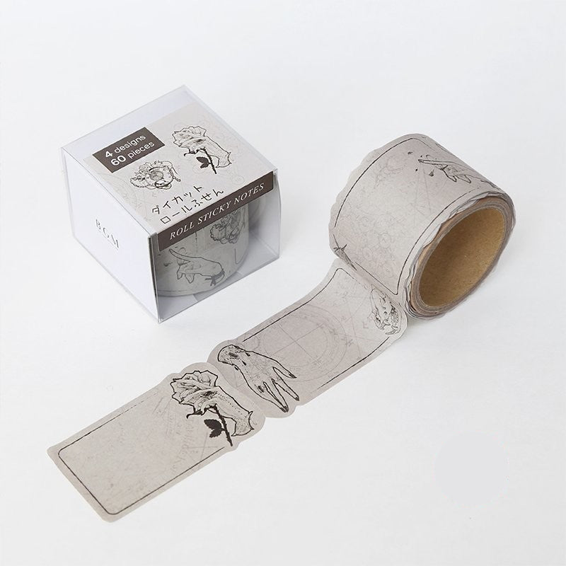 Roll of decorative sticky notes with floral designs and packaging on a white background