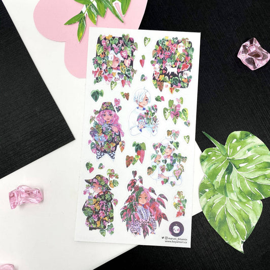 Sheet of colorful stickers with floral and character designs on a black background.