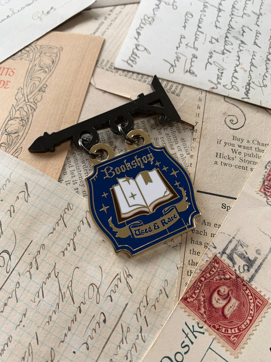 The Creeping Moon - Enamel Pin - Bookshop Sign