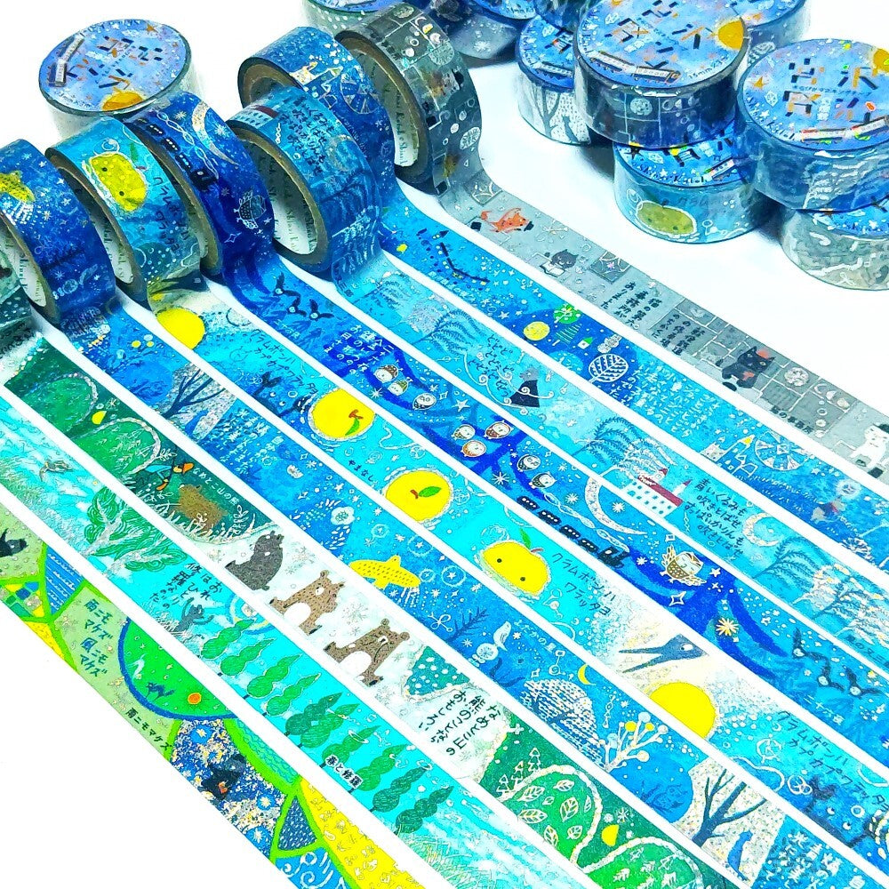 Set of colorful washi tape rolls with various designs on a white background