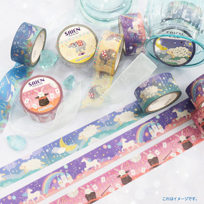 A collection of colorful washi tapes with whimsical unicorn, rainbow, and animal patterns, displayed alongside their illustrated washi tape rolls on a white background with decorative blue stones.